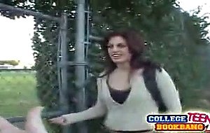 Long haired brunette college teen puts her lips on a ...