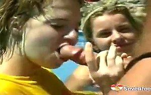 Two teen cuties sharing cock in their pool