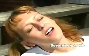 Tiny redhead teenie toying her pussy outdoor