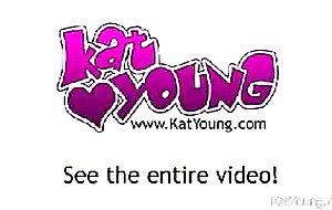 Kat plays in front of a mirror