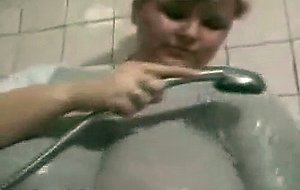 Fat lady showers her massive boobs