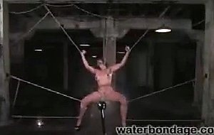 Long legged redhead is whipped, fucked and sprayed with water
