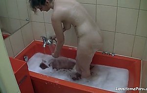 Chick takes a relaxing bath after the work
