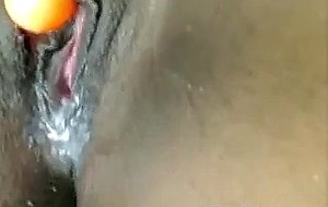 Horny black babe toys her wet pussy close up