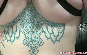 Inked punk beauty showing fake tits in bts