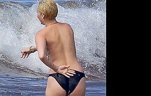 Miley cyrus shows her boobs in hawaii!