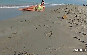 Nice mature woman shows her body at the beach