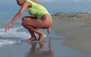 Nice mature woman shows her body at the beach