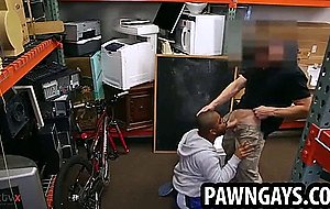 Ebony hunk sucks on a intense cock at the pawn shop