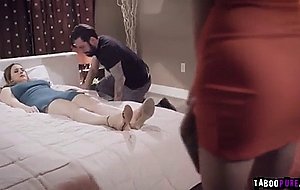 Escort lays down on bed to feed tommy  