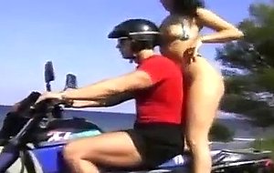 Bikini babe picked up by biker