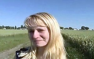 Cute farm girl gets naked in the field