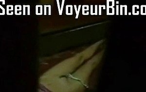Cute brunette caught masturbating by a voyeur  