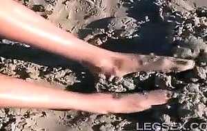 Jessica has sand between her toes