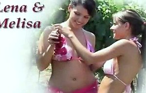 Lesbian Lena and Melisa kissing in the garden