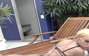 Dude fucks shemale in stockings by the pool