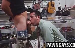 Horny stud sucks and tugs on a cock at the pawn shop