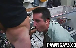Horny stud sucks and tugs on a cock at the pawn shop