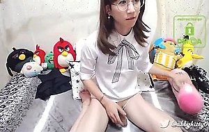Sexy young chinese teen shows off her flexibility with a dildo in her butt