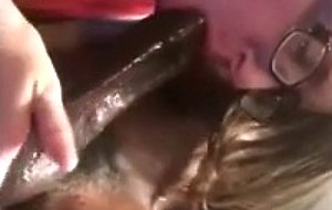 Nerdie teen blowing a black cock