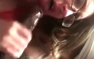 Nerdie teen blowing a black cock
