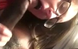 Nerdie teen blowing a black cock
