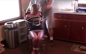 Blonde woman tied to chair &    