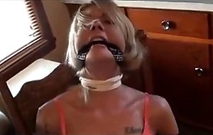 Blonde woman tied to chair &    