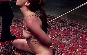Redhead is anal fucked in bdsm threesome