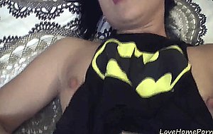 Girl in a batman shirt enjoys pleasuring herself