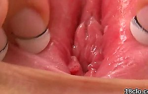 Lovable teen is opening up tight vagina in close-u  