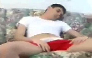 Guy masturbating on the couch