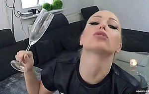 Blonde slut drinking cum from a glass