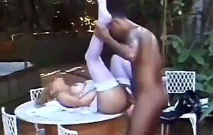 Outdoor doggy style fucking on a table