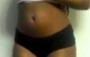 Ebony girl plays with her big toy