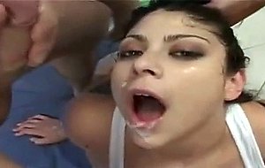 Young brunette putting two cock in her mouth