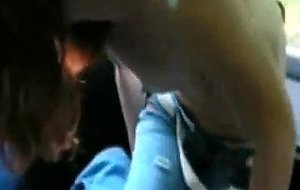 Skinny redhead undresses and sucks in the car