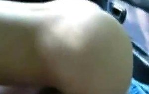 Skinny redhead undresses and sucks in the car