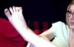 Hot blonde shows her feet on cam