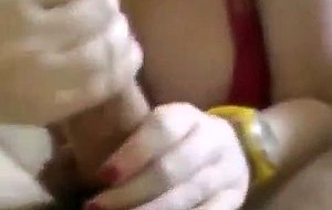 Busty girl friend gives teasing handjob with a yellow watch