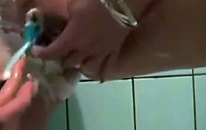 Wet soapy hairy college pussy gets shaved in the shower