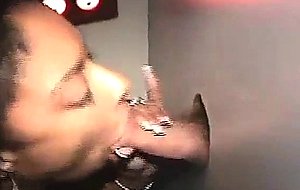 Dirty black whore sucking dick at glory hole