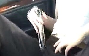 Chick plays with her pussy in the car...
