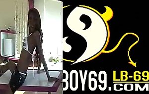 Beautiful tanned ladyboy plays with toys