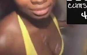 Black girl takes cumshot on her tits at glory hole