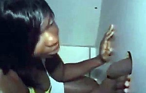 Black girl takes cumshot on her tits at glory hole