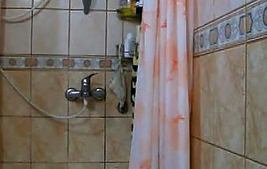 Amateur crossdresser in a shower