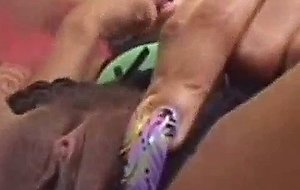 Ebony babe plays with her pussy