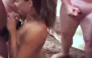 Brunette on her knees sucking cocks at tampa gangbang