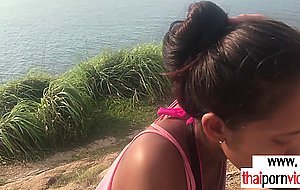 Amateur Thai teen Cherry giving a quick blowjob to BF at the beach outdoor